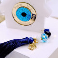 Lucky charm home with resin evil eye
